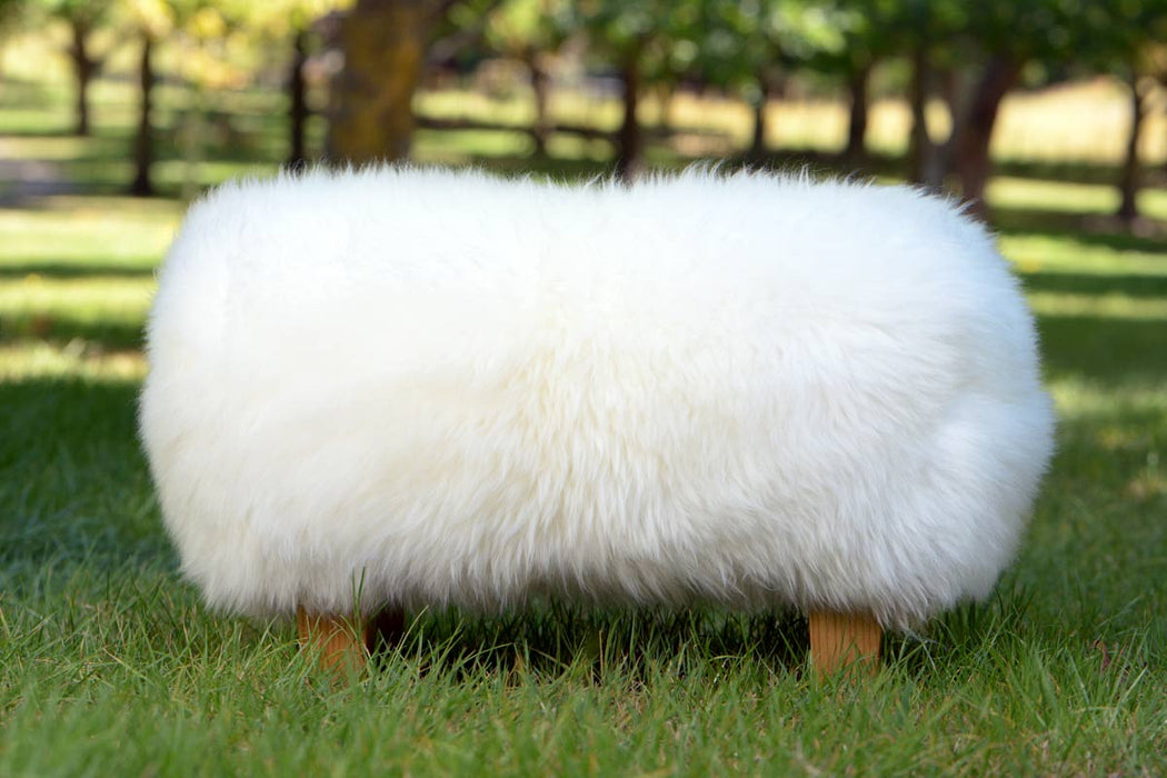 White Sheepskin Footstool with Light Wood Legs