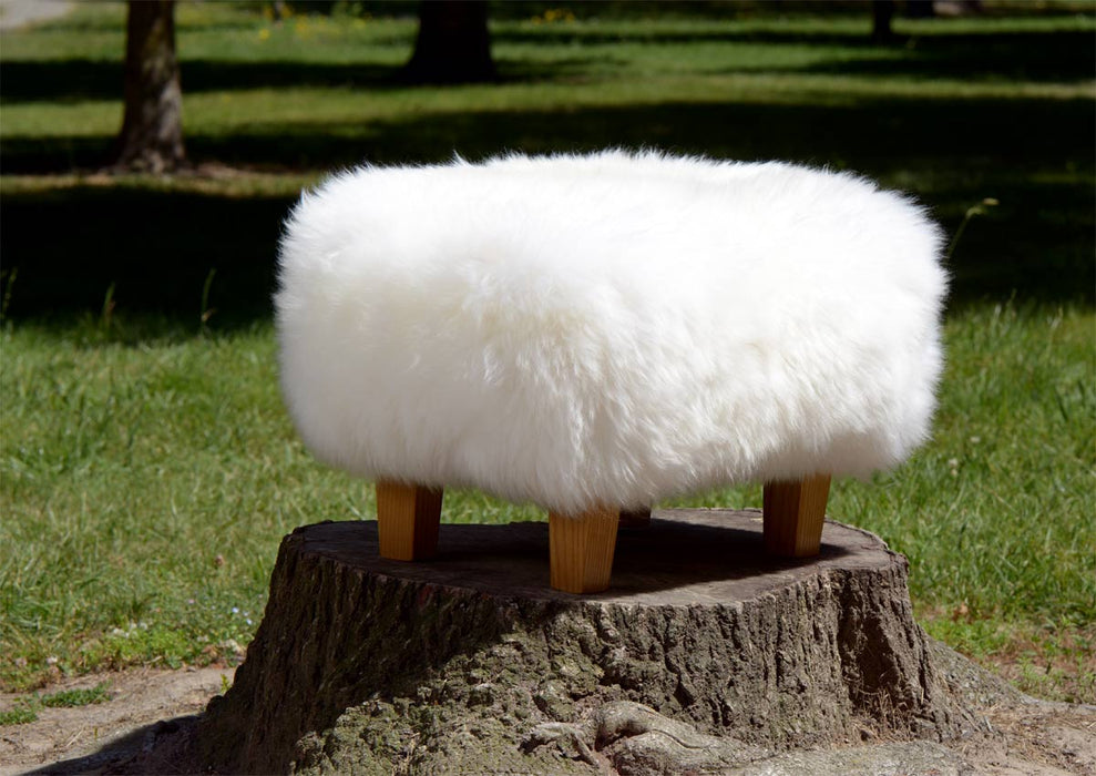 White Sheepskin Footstool with Light Wood Legs