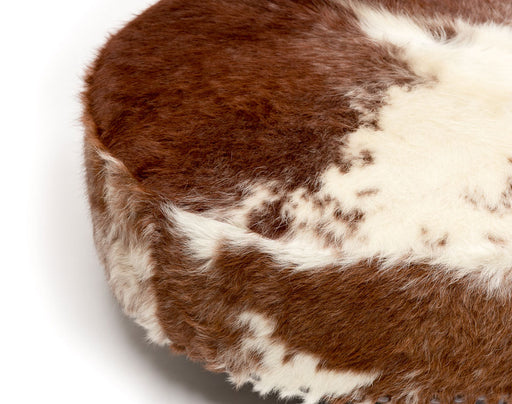 Close up of hairy cowhide ottoman