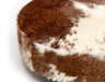 Close up of hairy cowhide ottoman