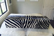 Large bench ottoman covered in zebra print