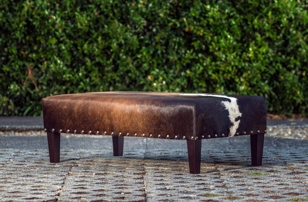 Cowhide Ottoman NZ Wood Legs & Antique Copper Studs 120x60x35cm