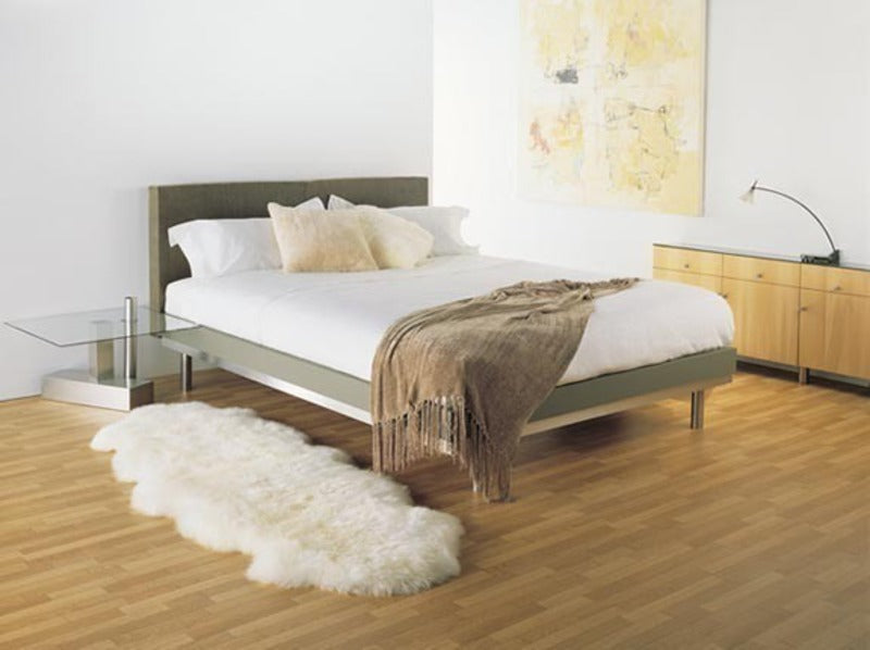 Ivory Wool Sheepskin Rug next to Queen bed