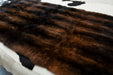 Natural Reddish Brown Possum Fur Bed Runner close up on a bed