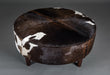 Chocolate brown round cowhide ottoman