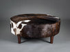 Chocolate brown round cowhide ottoman