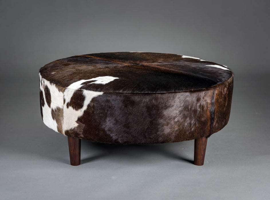 Chocolate brown round cowhide ottoman