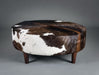 Chocolate brown round cowhide ottoman